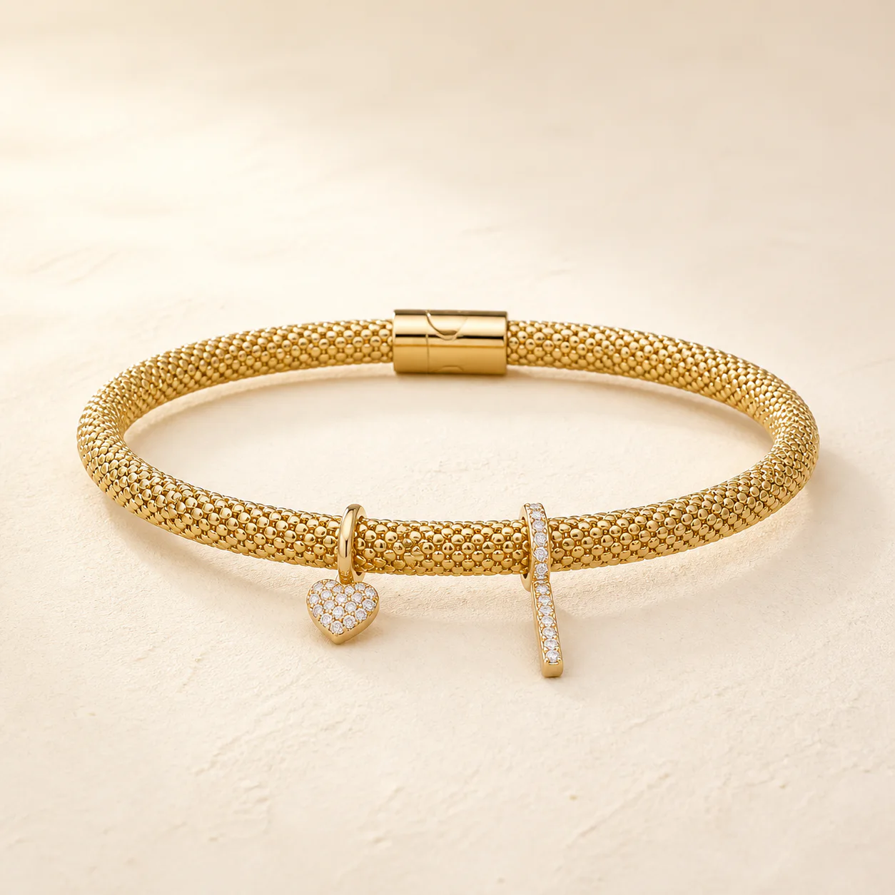 Gold and Diamond Charm Bangle from the Maison Burford collection